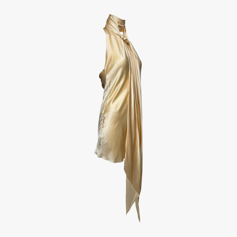 Champagne-gold silk satin halter mini dress by Dolce & Gabbana, back view with trailing tie detail