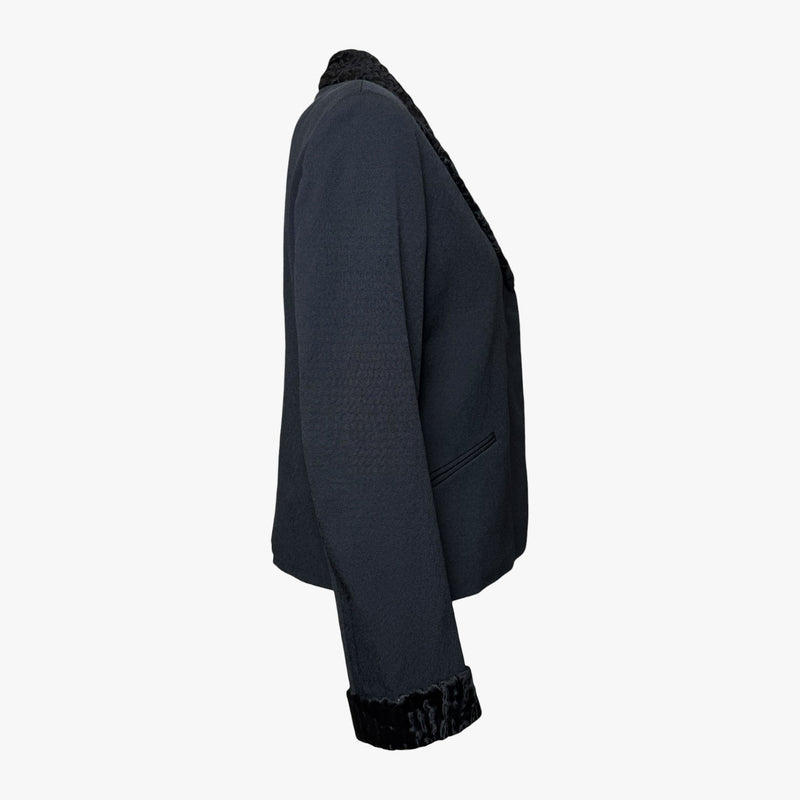 Charcoal silk blazer by Fendi, close-up of black astrakhan trim at cuff edge