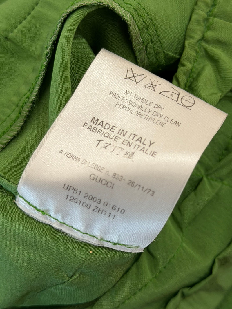 Lime green silk pencil skirt by Gucci, flat lay showing ruched fabric