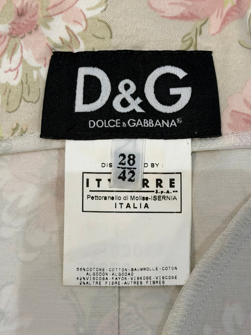 Closeup of Dolce & Gabbana dress neckline and shoulder strap detail, thin strap construction