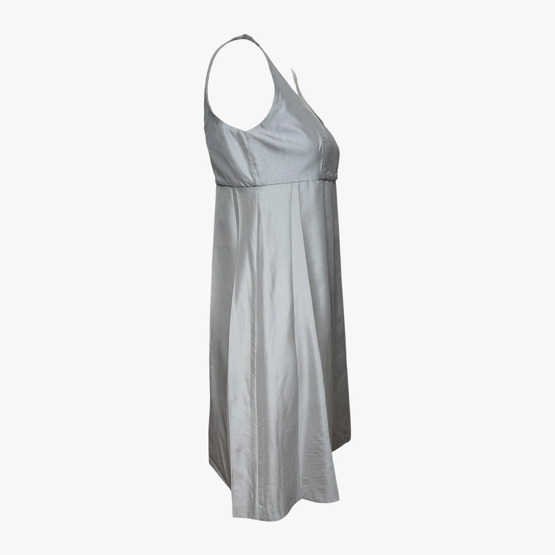 Pale grey silk empire waist dress by Prada, back view on dress form