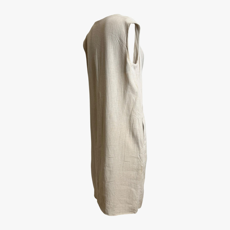 Beige linen sleeveless dress, back view of deconstructed seams