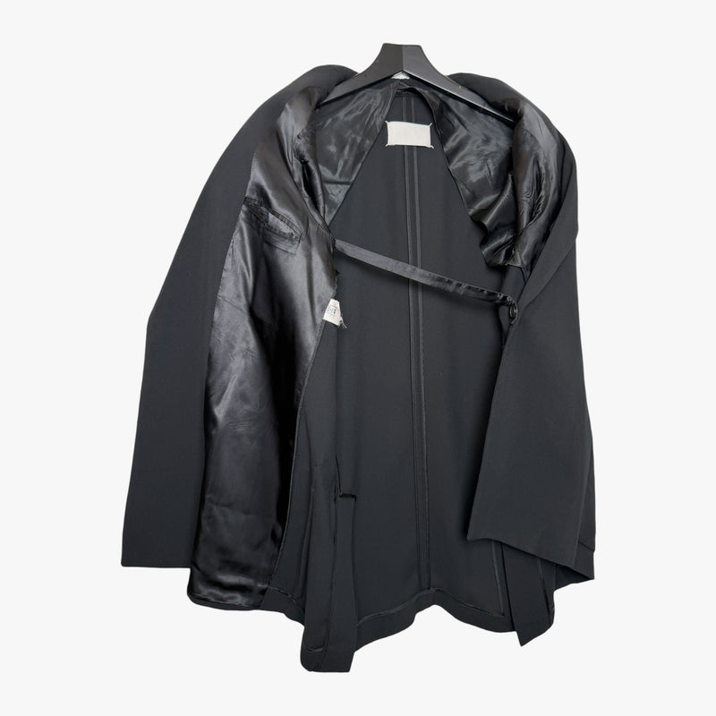 Charcoal deconstructed blazer by Maison Martin Margiela, side profile showing unconventional draping