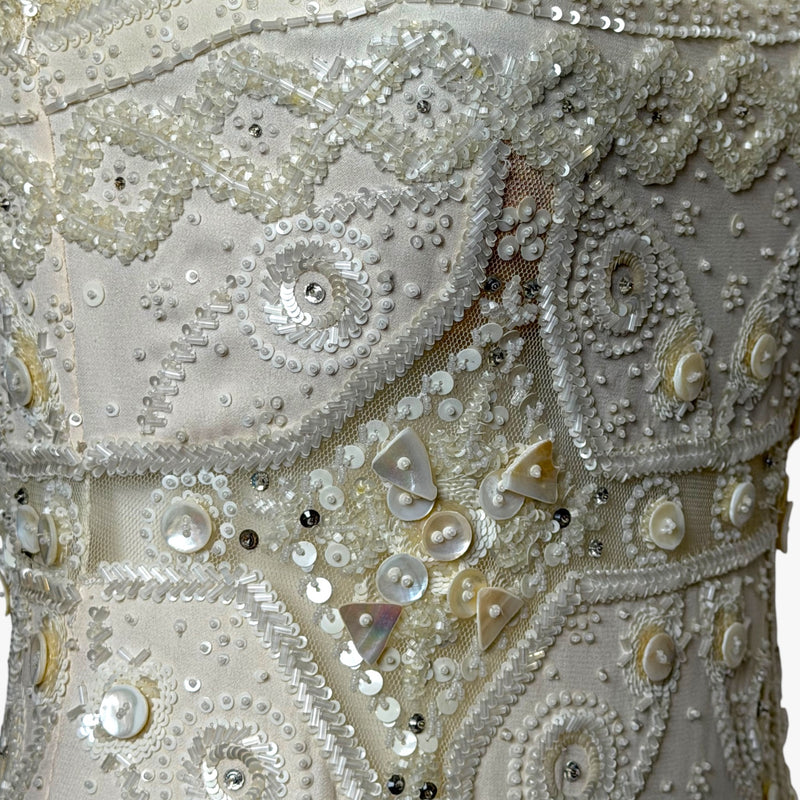 Valentino evening gown, side profile showing fitted bodice and beaded skirt