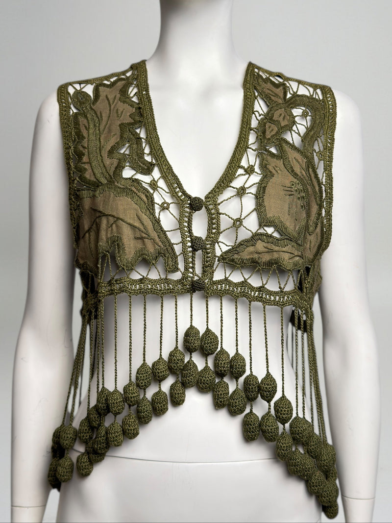 Olive green crochet vest by Romeo Gigli, Spring 1990, with botanical appliqué panels and knotted fringe hem