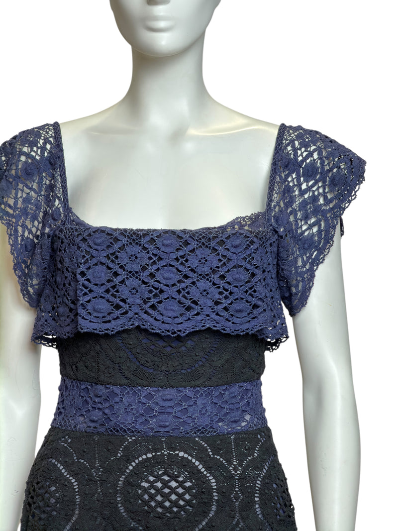 Back view of black and blue lace dress, layered lace panels with corseted structure, cap sleeves