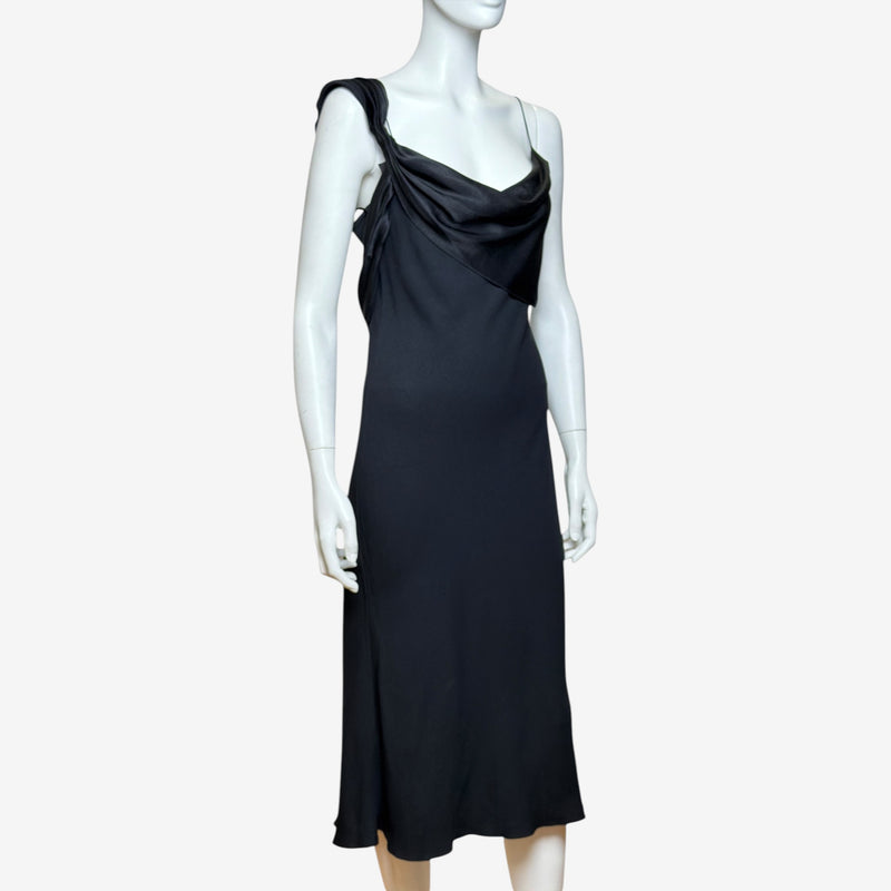 Black satin slip dress by John Galliano, front view showing cowl neckline and draping