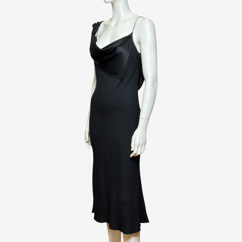 Black satin slip dress by John Galliano, side profile showing bias-cut silhouette