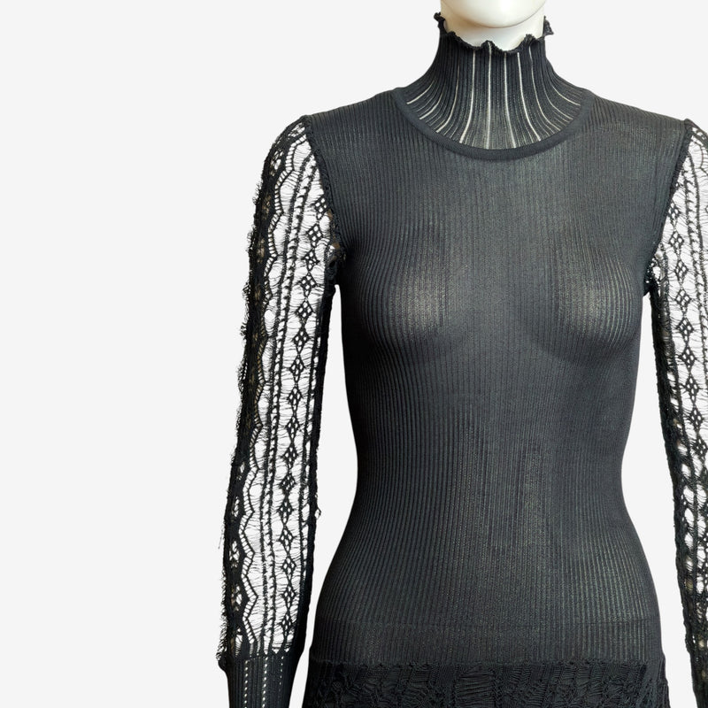 Black gown with geometric lace sleeves, close-up sleeve detail