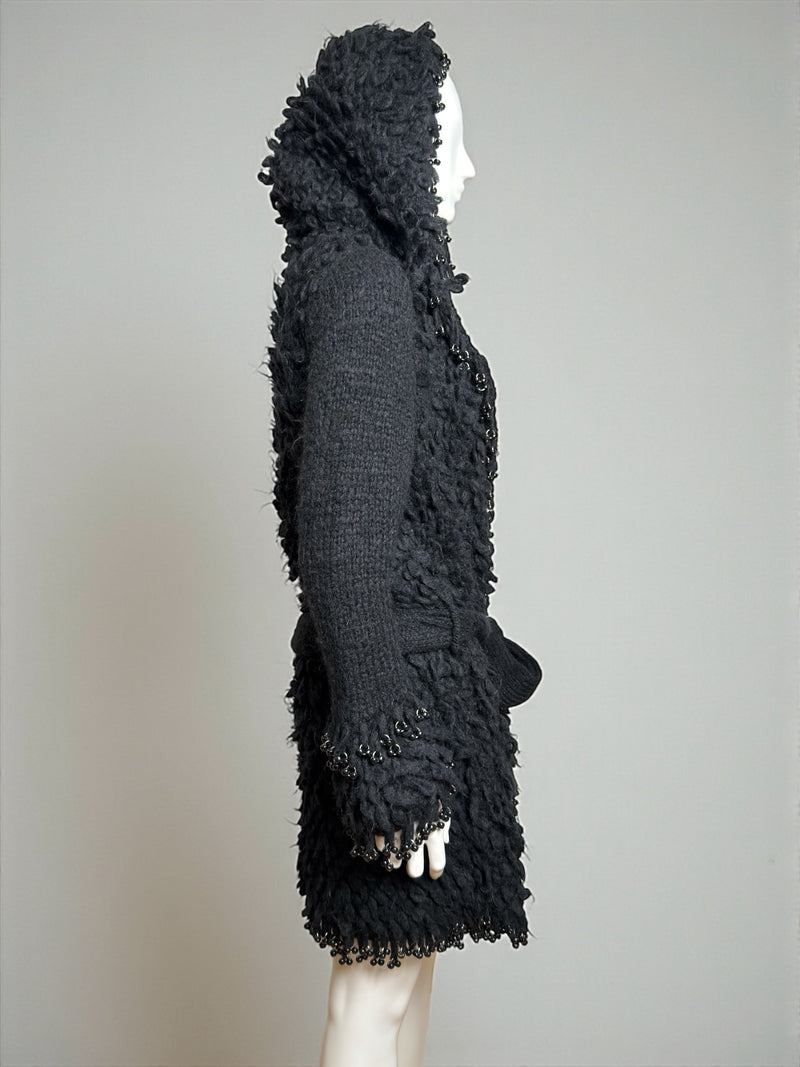 Black wool hooded coat by Paco Rabanne, detail of hood and neckline