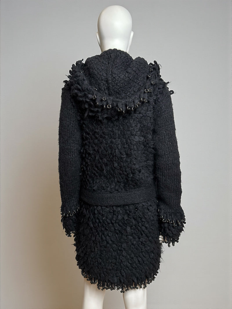Black wool hooded coat by Paco Rabanne, front closure and hem detail