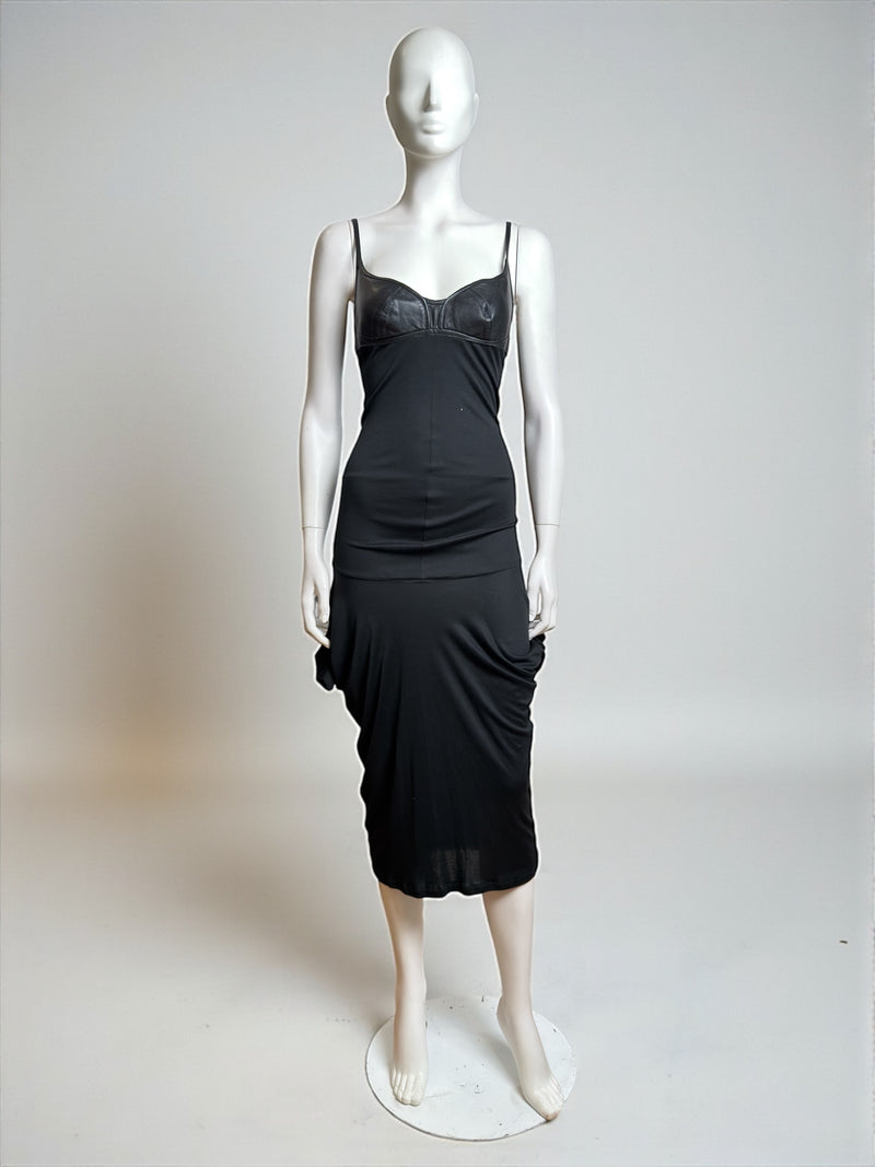 Black midi dress by Alexander McQueen with structured leather bodice, front detail