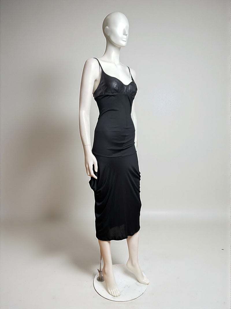 Alexander McQueen black dress with molded leather cups and jersey skirt, three-quarter view