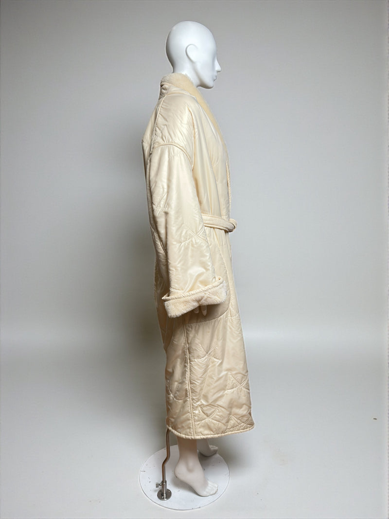 White shearling fleece bathrobe coat by Thierry Mugler, side profile showing oversized cut and faux fur lining