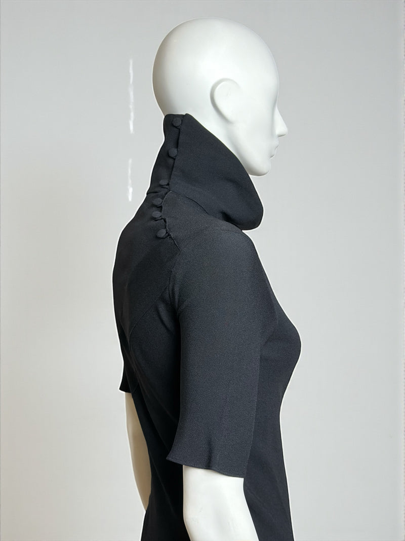Black gown by John Galliano, close-up of high neckline and shoulder construction