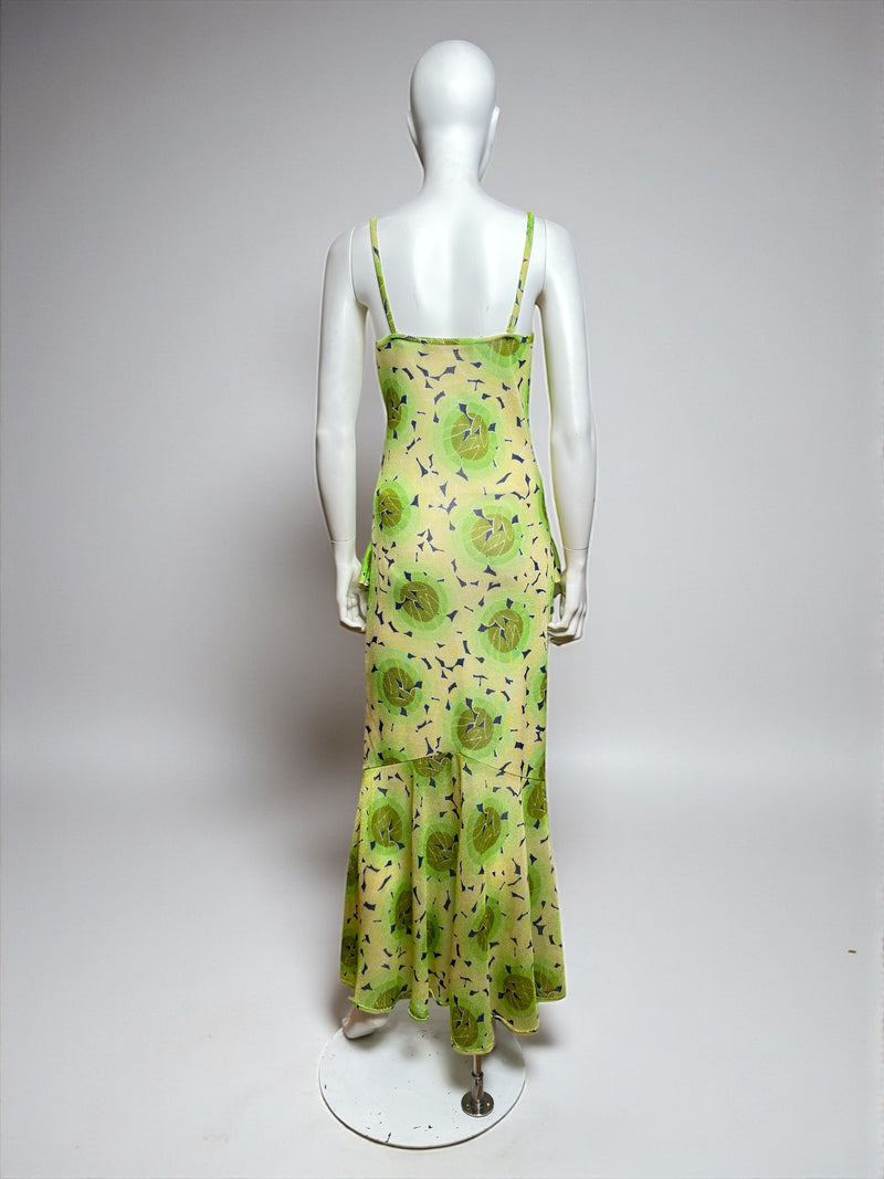 Green lotus jersey dress back view showing tiered ruffle panels and fluid hem construction