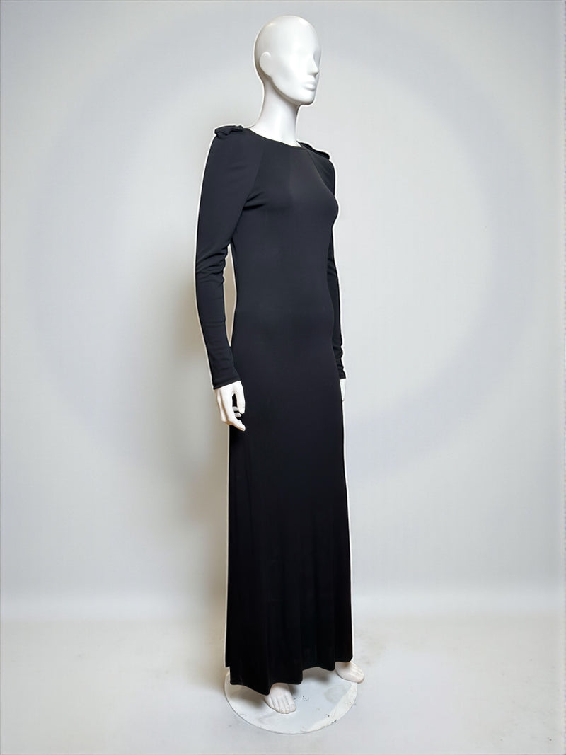 Black evening dress by Gucci Tom Ford, side view of backless design and long sleeve detail
