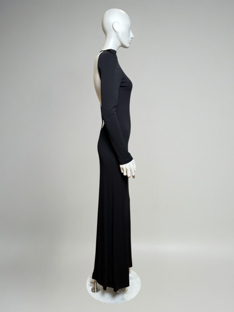 Black evening dress by Gucci Tom Ford, rear view showing dramatic open back and floor-length hem