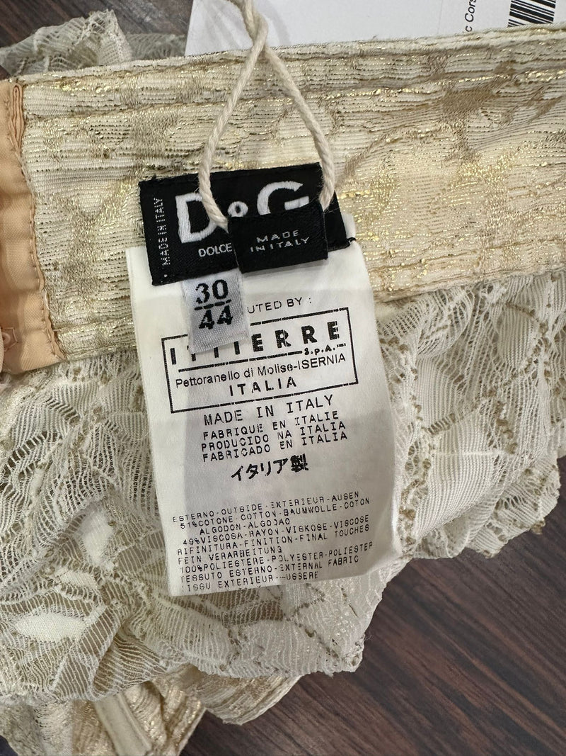 White lace bustier top by Dolce & Gabbana, detail of rose and botanical motifs with metallic accents