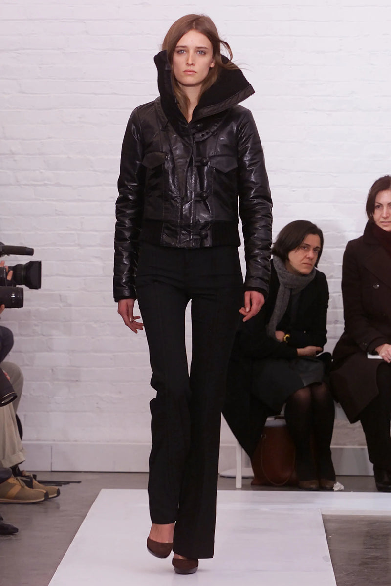 Balenciaga F/W 2002 runway look, black leather bomber with knit collar