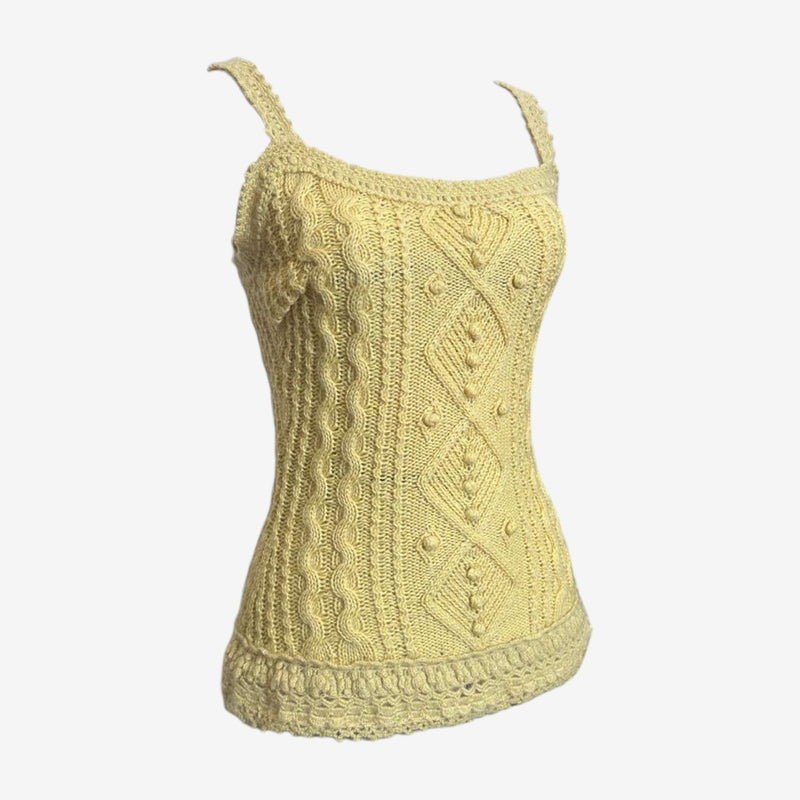 Back view of beige Louis Vuitton tank top with continuous cable knit patterns and braided hem border