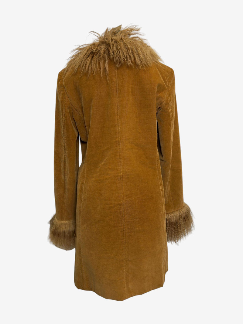 Camel shearling coat by Dolce & Gabbana, cuff detail showing curly fur trim and leather loop fastenings