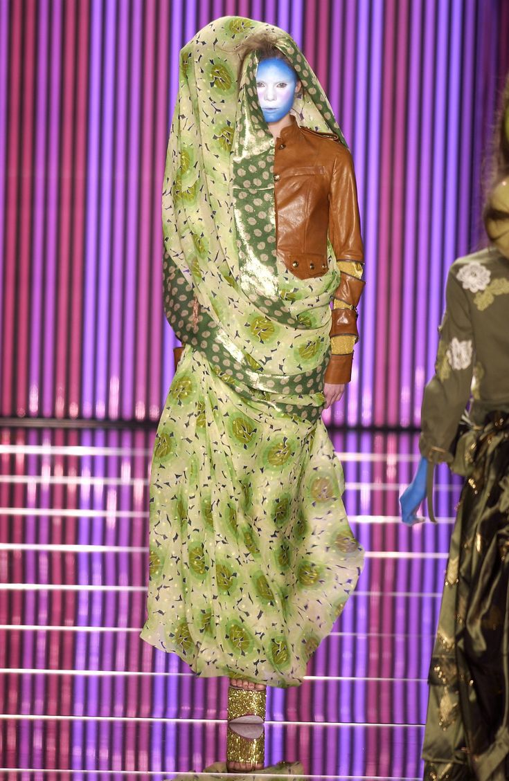 Green lotus printed viscose jersey detail showing Galliano's bias-cut construction and fluid draping