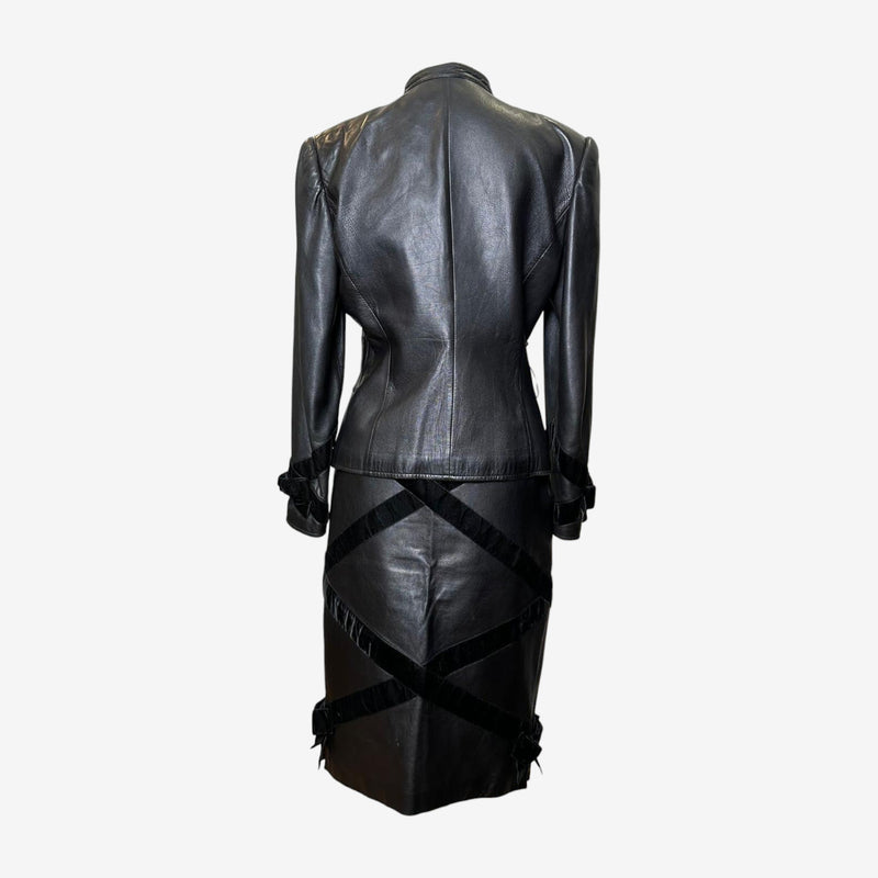 Black leather ensemble by Valentino, jacket and skirt with architectural leather detailing