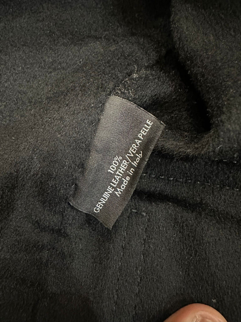 Black leather moto jacket by Gucci Tom Ford, interior leather label detail