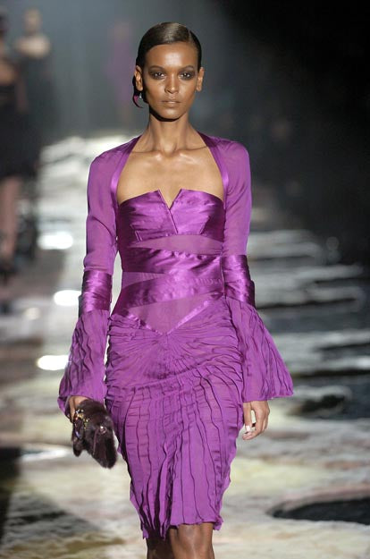 Purple pleated midi dress by Gucci Tom Ford, side profile showing fitted sleeves and midi length