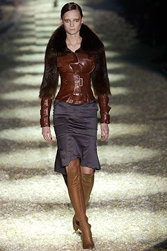 Gucci Tom Ford pencil skirt, side view showing asymmetrical hemline and hip buckle straps
